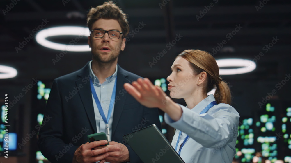 Gesturing woman talking software developer cloud computing server farm closeup