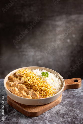 Chicken stroganoff with rice and straw potatoes. Strogonoff. © WS Studio