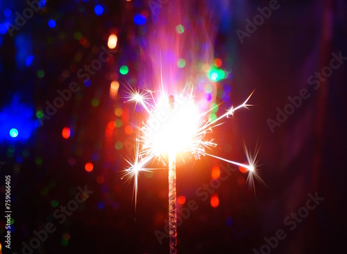 Sparkling sparklers at night. Bright Christmas background. A festive event.