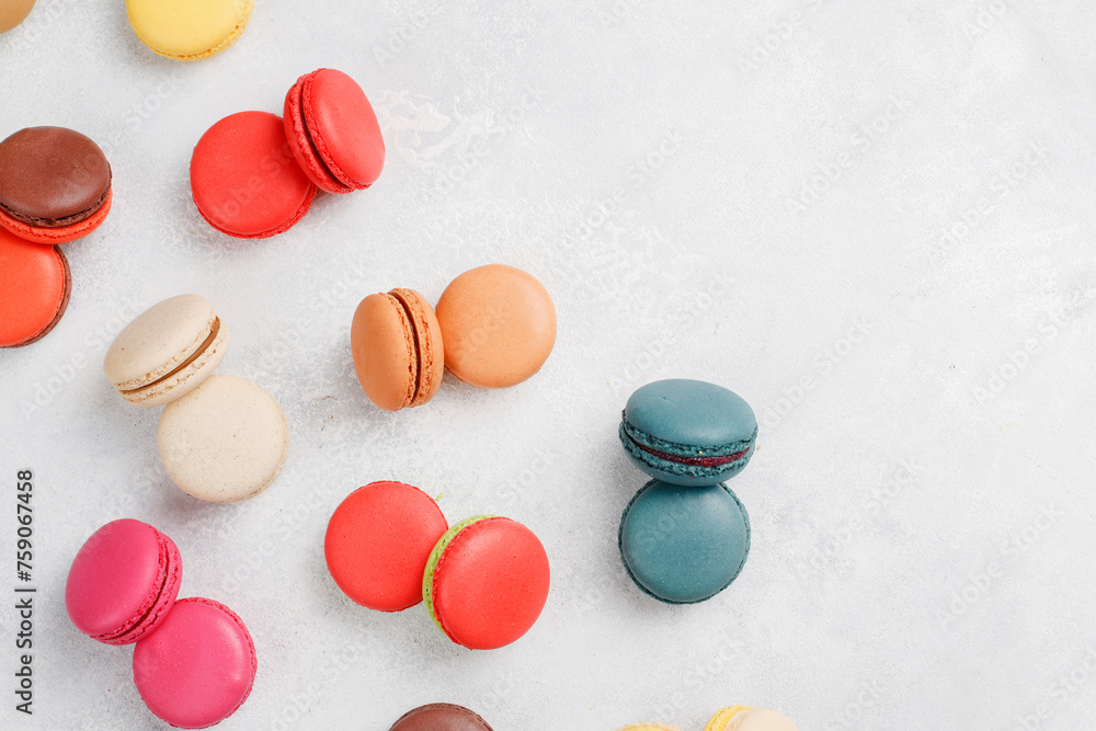 Obraz premium Colorful french dessert macarons with fresh fruits and nuts.