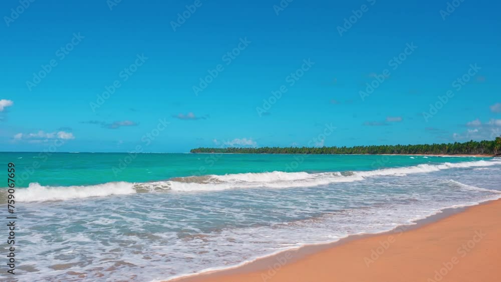 Bali seascape with turquoise waves on a beautiful yellow sand beach. Nature paradise sea island, open Indonesia. Summer vacation on the ocean. Travel to a tropical paradise. Bali seascape with turquoise waves on a beautiful yellow sand beach. Nature paradise sea island, open Indonesia. Summer vacation on the ocean. Travel to a tropical paradise.