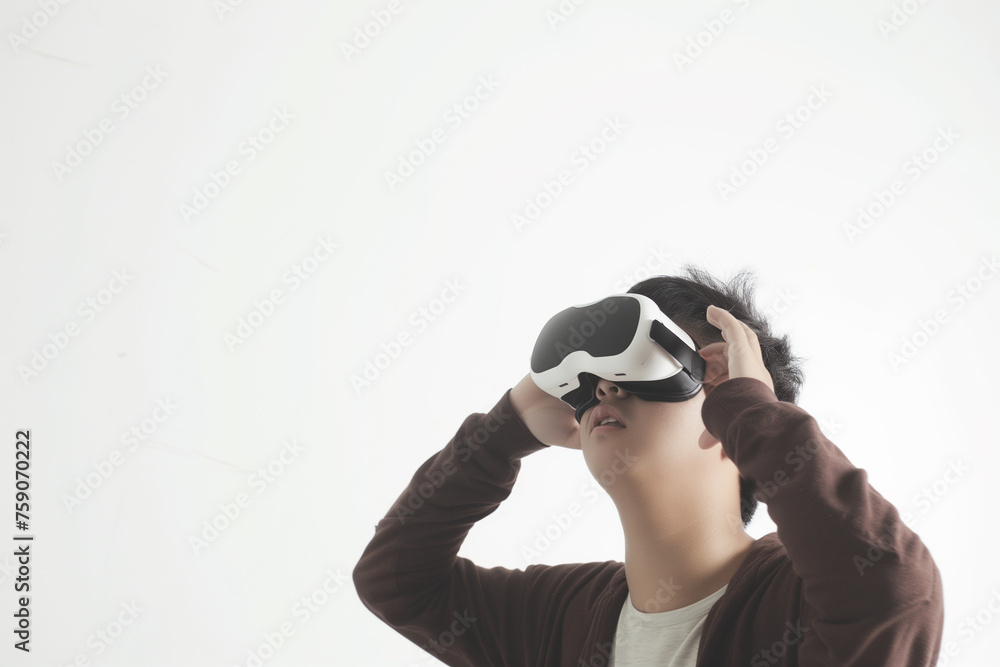 Fototapeta premium Young boy experiencing virtual reality simulation using virtual reality headset. Isolated on white background