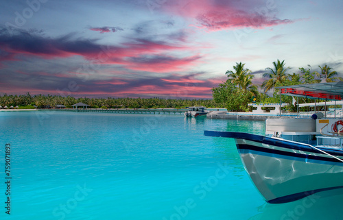 Colourful sunset at the maldive island with a boat and boardwalk © Stockwerk-Fotodesign