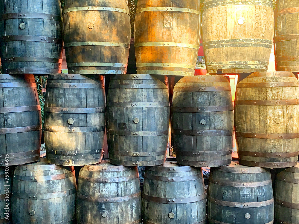 Old, oak whisky barrels stacked for reuse