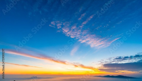 beautiful blue morning sky with many little small fluffy clouds in sunlight and yellow orange sunset sunrise background texture