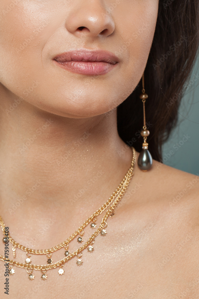 Perfect jewelry model closeup. Golden Necklace and earring with pearls