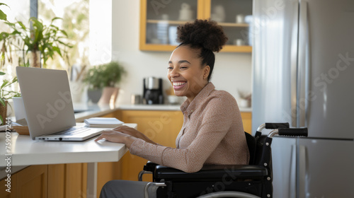 Woman in a wheelchair works from her home office.