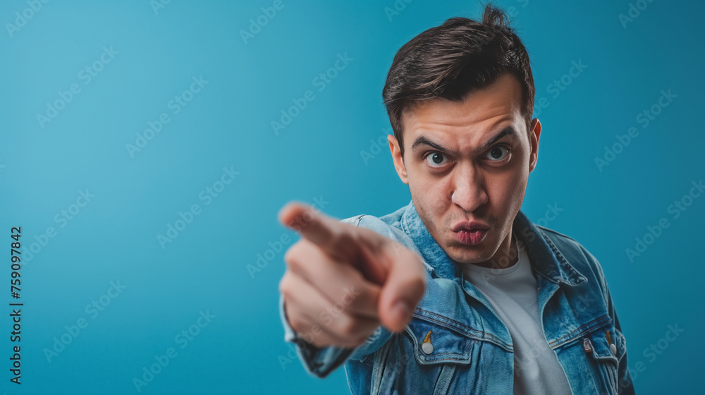 Naklejka premium Man pointing accusingly at viewer.