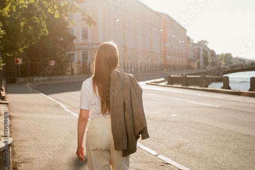 Woman walking away photo