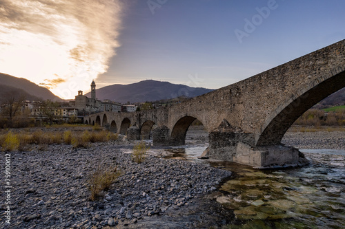Aerial view of Bobbio town and Gobbo Bridge of Devil at sunset
