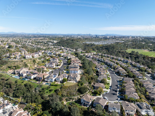 Aerial view of middle class subdivision neighborhood with residential condos and houses in San Diego, California, USA. © Unwind