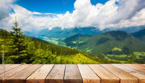empty wooden table top with blur background of mountain landscape