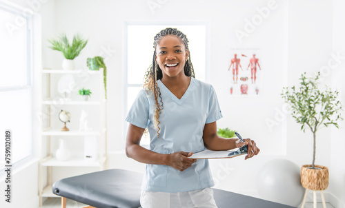 portrait of a black physiotherapy person in uniform photo