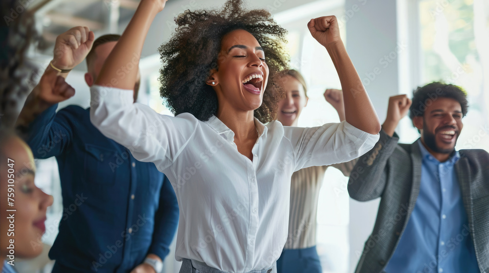 Joyful office workers are celebrating a success with their hands raised in the air and big smiles on their faces in a bright, modern office space. Joyful office workers are celebrating a success with their hands raised in the air and big smiles on their faces in a bright, modern office space.