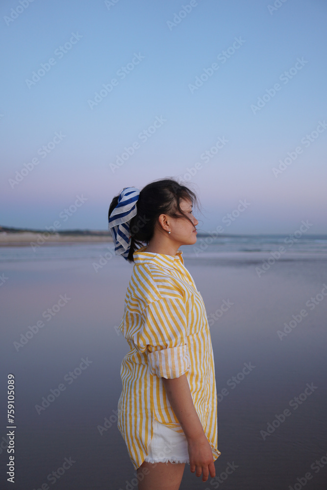 Portrait of a young Nepalese woman with dark hair at the seaside Portrait of a young Nepalese woman with dark hair at the seaside