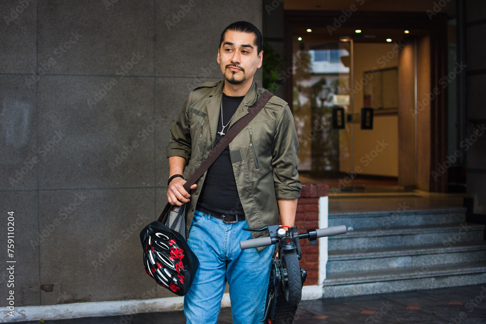 Adult latino man using scooter Adult latino man using scooter