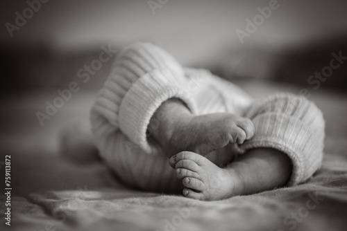monochrome image of Tiny toes of newborn baby photo