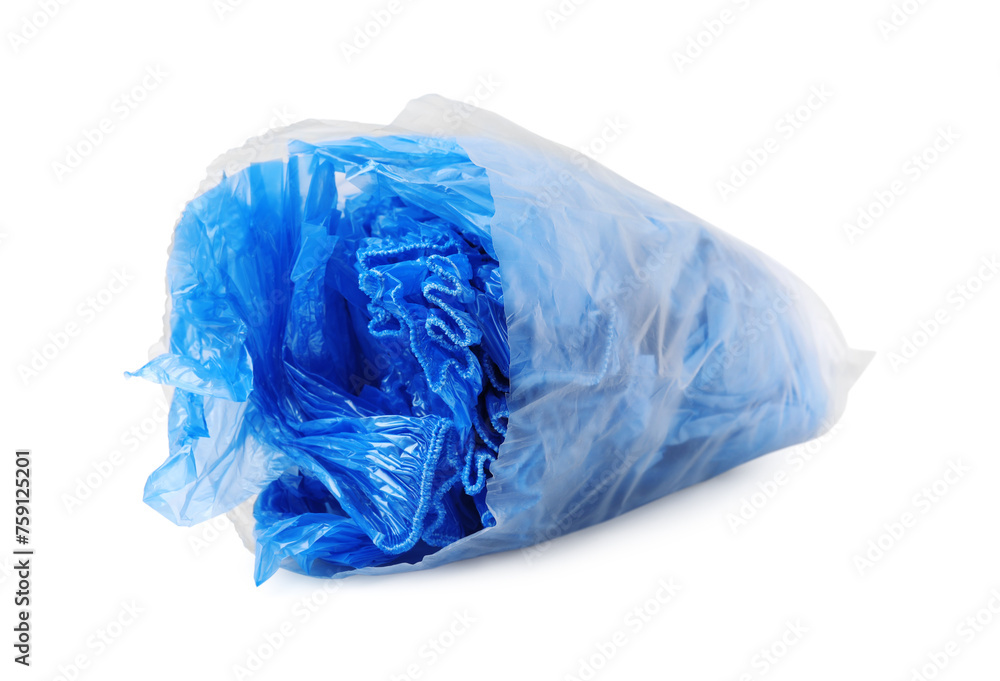 Blue medical shoe covers in package isolated on white Blue medical shoe covers in package isolated on white
