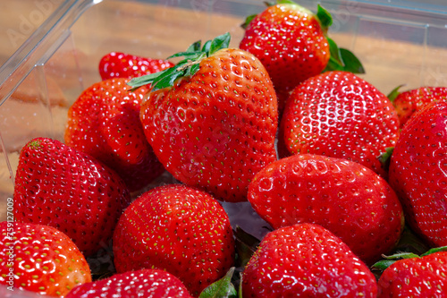 New harvest, plate with bio ripe red sweet strawberry from Spain
