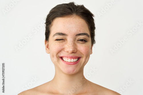Bild auf Leinwand Happy Latin girl, young playful smiling woman model with freckles winking isolated on white background advertising healthy facial skin care products, skincare cosmetic treatment, beauty portrait