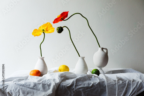 beautifully decorated table with vibrant flower-filled vases photo