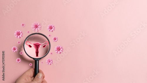 Female fertility concept, magnifying glass with ovary and flowers representing fertility.