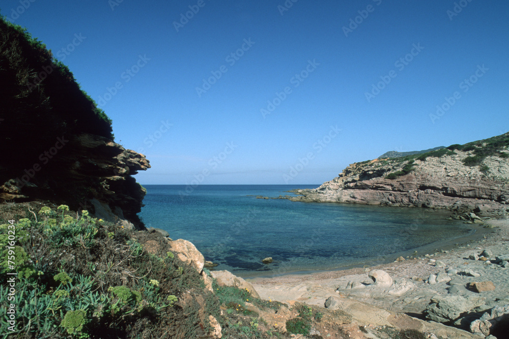 coast of island, beach with sky, Rocky shore. Bay of Porto Ferro. Sardinia, Italy.