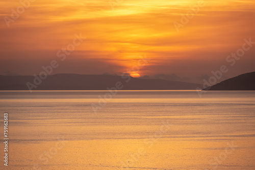 Idyllic sunset view of Dalmatian archipelago seen from coastal town Makarska, Split-Dalmatia, Croatia, Europe. Silhouette of islands. Coastline of Makarska Riviera, Adriatic Sea. Balkans in summer © Chris