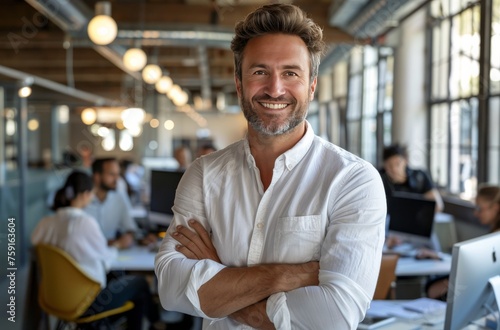 Man Standing in Office With Arms Crossed