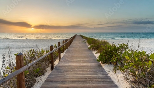 boardwalk leading to the white sand beach photo