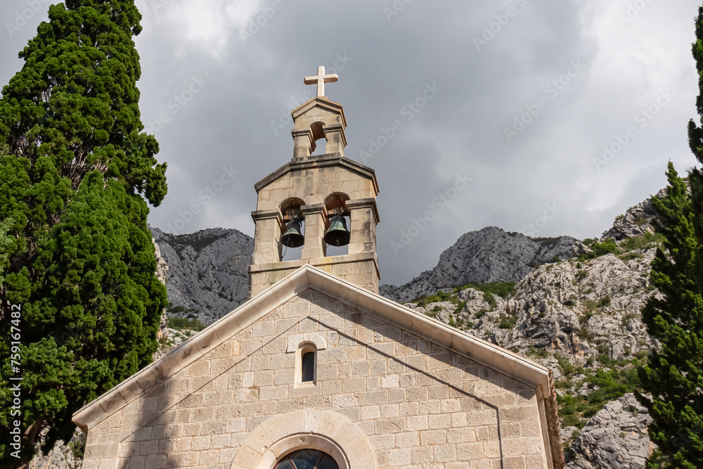 Scenic view of ancient catholic church of St. Anthony in village Kotisina near Makarska, Split-Dalmatia, Croatia, Europe. Hiking in Biokovo nature park in mountain of Dinaric Alps, Balkan. Tourism Scenic view of ancient catholic church of St. Anthony in village Kotisina near Makarska, Split-Dalmatia, Croatia, Europe. Hiking in Biokovo nature park in mountain of Dinaric Alps, Balkan. Tourism