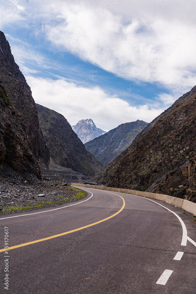 The beautiful scenery of snow-capped mountains along the Duku Highway in Xinjiang, China The beautiful scenery of snow-capped mountains along the Duku Highway in Xinjiang, China