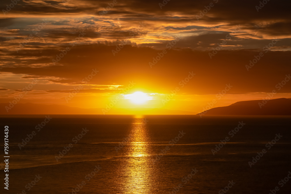 Aerial sunset view of Dalmatian archipelago seen from coastal town Makarska, Split-Dalmatia, Croatia, Europe. Silhouette of islands. Coastline of Makarska Riviera, Adriatic Sea. Balkans in summer Aerial sunset view of Dalmatian archipelago seen from coastal town Makarska, Split-Dalmatia, Croatia, Europe. Silhouette of islands. Coastline of Makarska Riviera, Adriatic Sea. Balkans in summer