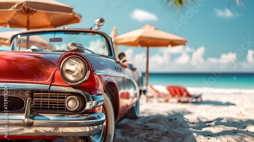 A vintage car parked on a beach, with details of the car's classic design, the beach's white sand and blue water, and the beach umbrellas in the background.