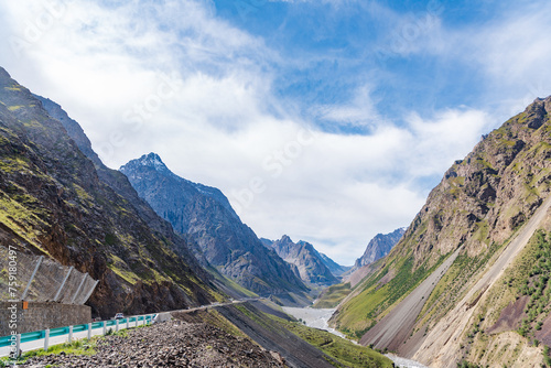 The beautiful scenery of snow-capped mountains along the Duku Highway in Xinjiang, China photo