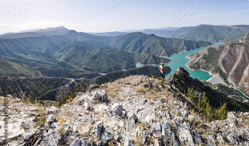 Canvas Print Blue green Kozjak lake surrounded by hills in the mountains of Macedonia