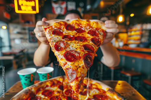 Eating Huge Pizza in Restaurant photo
