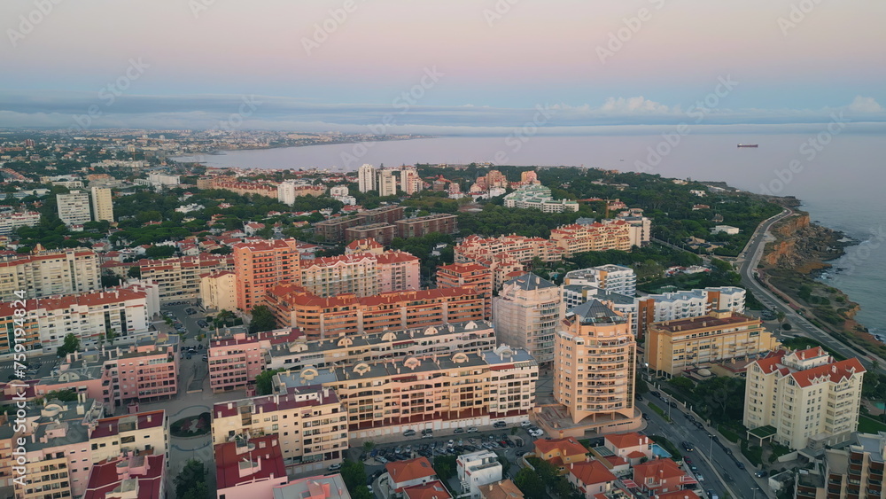 Evening scenery coastal town aerial view. Buildings on picturesque waterfront