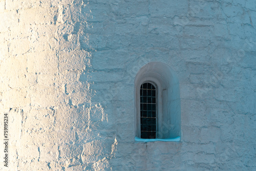 An apsis window of the Balke Medieval Stone Church, Toten, Norway. photo