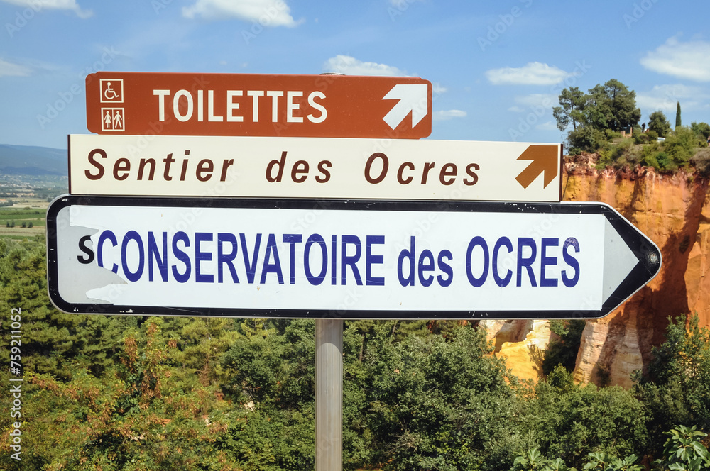 Direction sign to Sentier des Ocres - Ochre Trail nature park in Roussillon town