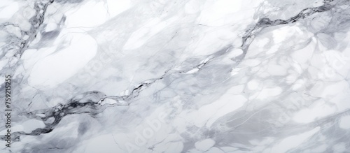 A closeup of a white marble texture on a white background resembling the fluidity of freezing water. The monochrome photo captures the beauty of this meteorological phenomenon