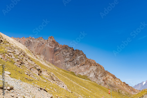 The beautiful scenery of snow-capped mountains along the Duku Highway in Xinjiang, China photo