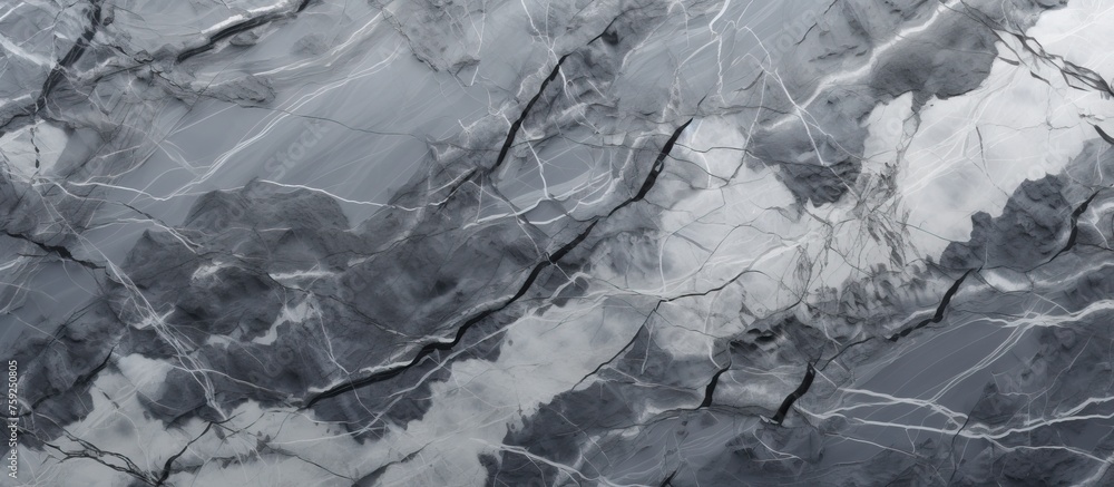 A close up of a grey and white marble texture resembling a freezing winter landscape, with a pattern of wind waves and rocks on a slope A close up of a grey and white marble texture resembling a freezing winter landscape, with a pattern of wind waves and rocks on a slope