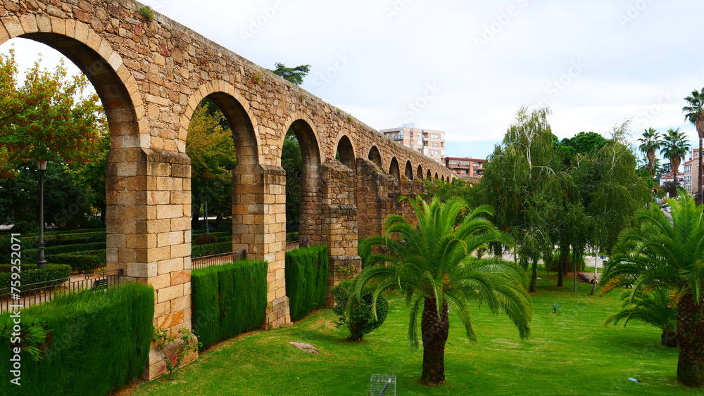 Plasencia aqueduct Roman rest architecture archeology stone constructions palm trees green grass