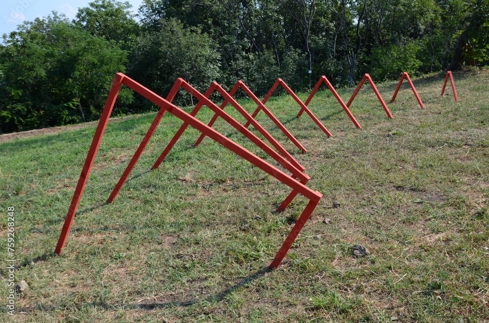 red geometric sculpture in the meadow red geometric sculpture in the meadow