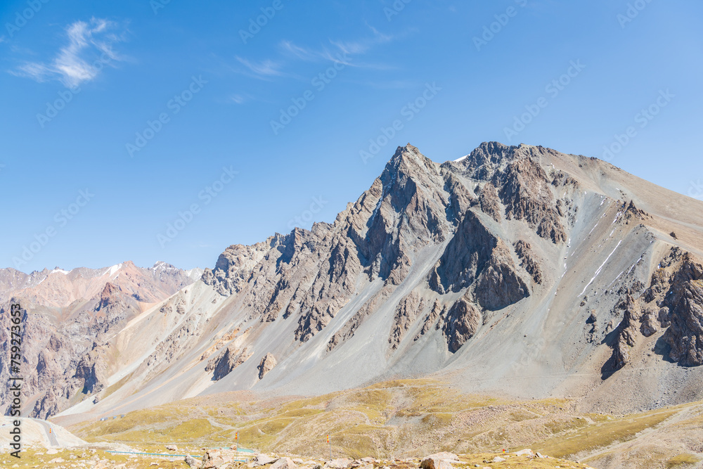 The beautiful scenery of snow-capped mountains along the Duku Highway in Xinjiang, China The beautiful scenery of snow-capped mountains along the Duku Highway in Xinjiang, China