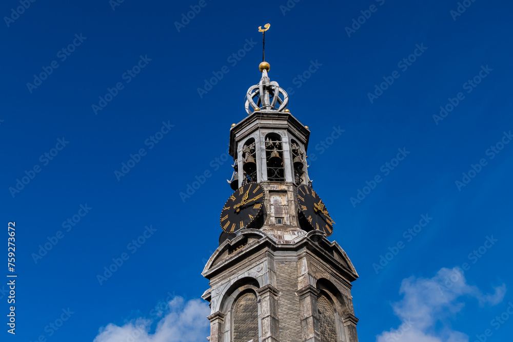 Fragment of Amsterdam Mint Tower (or Munttoren, 1620) at Muntplein square near flower market. Munttoren was originally part of gate in Amsterdam's medieval city wall. Amsterdam, the Netherlands.