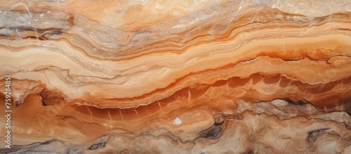 A close up of a bedrocktextured marble with a beautiful amber swirl pattern resembling wood grain. A natural material perfect for adding elegance to any dish or cuisine