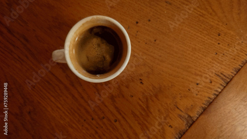 demitasse of black espresso -  doppio nero espresso  on the dining room table     