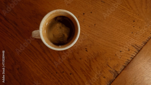 Fotografie demitasse of black espresso - (doppio nero espresso) on the dining room table